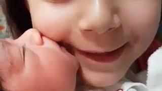 Cute Baby Girl Kissing lovely Sister. Nice Baby. Beautifull baby girl.